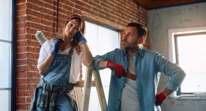 Displeased couple having problems during home renovation project.